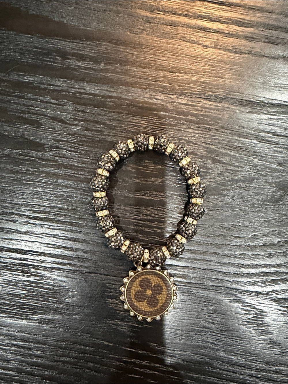 Brown and Gold Beaded Bracelet with Decorative Medallion